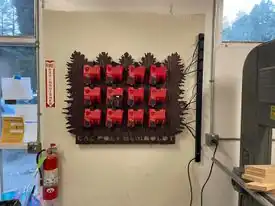 Battery managementCustom board and 3D prints to organize, store, and charge M18 Milwaukee batteries.