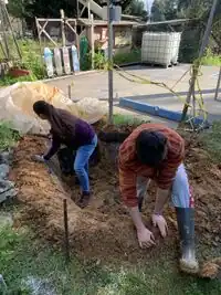 Image 2: Excess clay from the excavation was used to build up the berm. We packed it in and molded it to our desired shape.