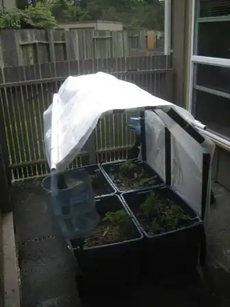 The GnomeTainerModular, raised garden with integrated rain catchment that can be installed on a porch