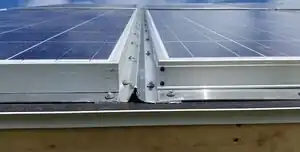 Design of Post-Consumer Modification of Standard Solar Modules to Form Large-Area Building-Integrated Photovoltaic Roof Slates