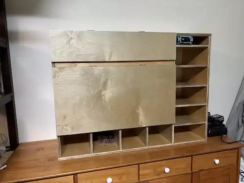 PPE cabinet with cabinet doors installed and glove compartment on the right subdivided.