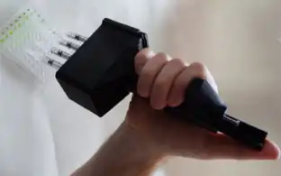 Open Source 3-D Printed ISO 8655 Compliant Multichannel Pipette