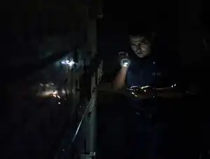 Long-term cost-effectiveness of interventions for loss of electricity/industry compared to artificial general intelligence safety