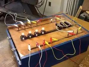 Electrical wiring apparatusDevice to teach series and parallel wiring using intrigue