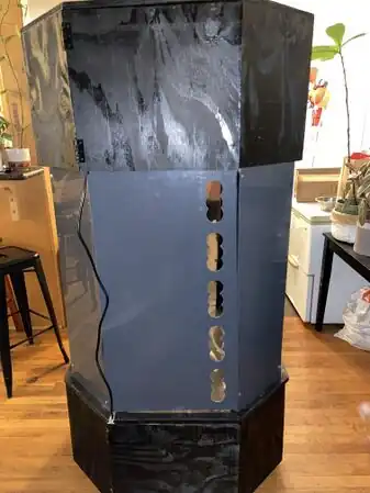 Figure 3) To maximize circular airflow we drilled holes along the left side of the middle sheet.