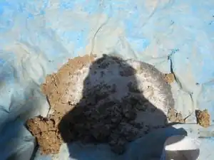 Fig.14 Sand and clay on a tarp ready for mixing