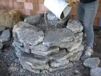 Fig.3 Pouring rubble and sand in the foundation to give it support