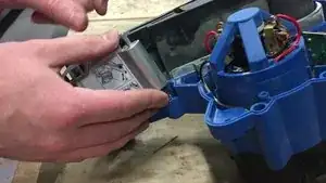 Remove the front belt cover from the machine.
