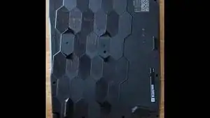 The first step is to take your screwdriver and remove all 13 screws keeping the back panel in place. After every screw is removed and placed in or on something where you won't lose it, carefully life up the back panel off of the laptop.