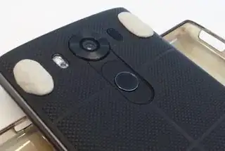 Click photo for full size Phone back with gum-tack stuck on the back