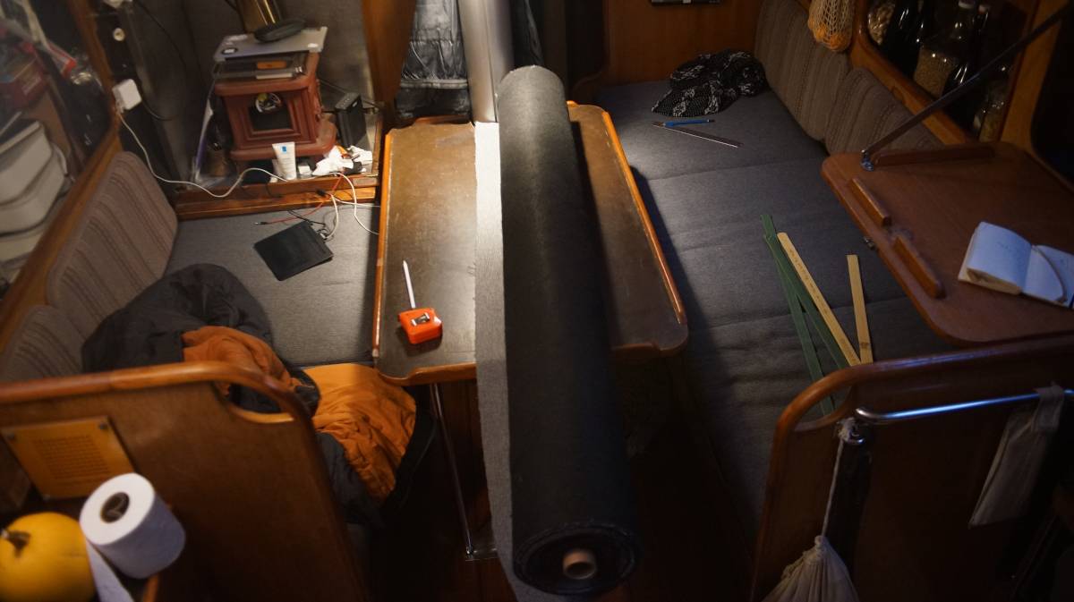 a giant roll of fabric sitting on the tiny saloon table