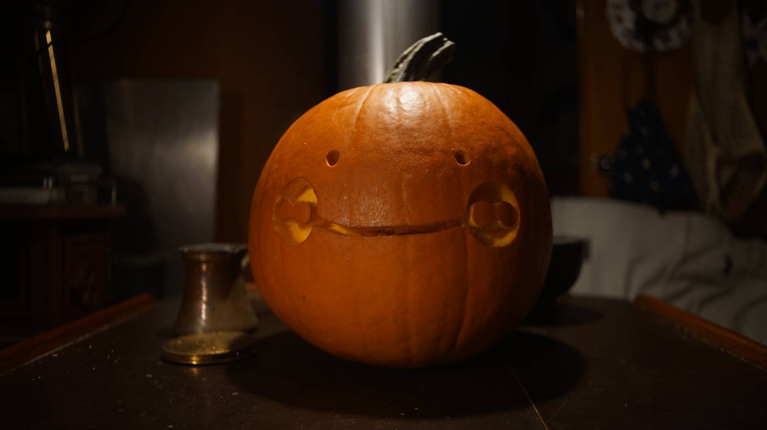 A photo of an Uxn face carved onto a pumpkin