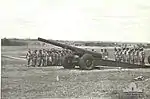 'T' Australian Heavy Battery at Fort Lytton with M1917/1918 155-millimetre (6.1 in) heavy gun. Heads are bowed during a ceremony on Armistice Day 1943