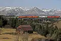 Spot Mountain seen with Two Medicine River train trestle