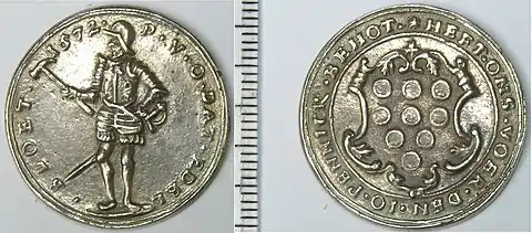 Two sides of a silver token