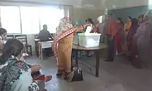 A voter casts their vote in the 2013 general elections