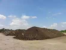 Image 31Alignment of several compost piles on a composting facility in France (from Garden design)