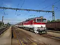 Diesel locomotive with passenger cars at Bánovce nad Ondavou train station