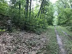 On the opposite side, B = Boston 68 miles (109&nbsp;km). All mile markers add to 104.