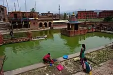 Washing in Khya:h Pukhu, Bhaktapur