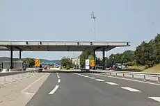 Open Schengen Area border crossing at the Slovenian-Italian border, with abandoned rain shelter