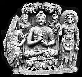 Gandhara Buddhist Triad from Sahr-i-Bahlol, c. 132 CE, similar to the dated Brussels Buddha. Peshawar Museum.