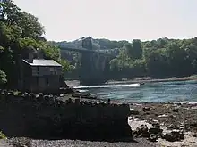 Carreg yr Halen at low tide with Pont y Borth in the background