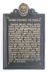 Placa informativa de la historia del centro