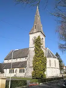 Christ Church, Winchester, Hampshire, 1861 by Ewan Christian, showing the south-east tower and broach spire and the polygonal chancel apse. The church has a striking clerestory with cinquefoil windows