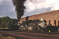 Two DRGW locomotives waiting to be serviced at the Chama engine house, 1967.