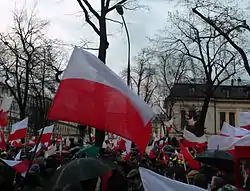 Protestors in Warsaw waving Polish flags
