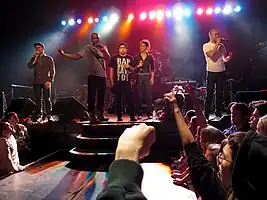 Doomtree performing at First Avenue in 2010 (left to right: Cecil Otter, P.O.S, Mike Mictlan, Dessa, and Sims)