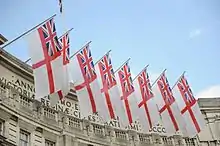 Admiralty Arch is customarily decorated with White Ensigns on state occasions.