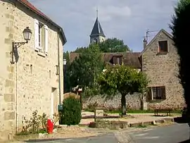 The fountain in Frémainville, with the church in the background