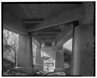 Looking west from the east side of the central span from below the skewed substructure is seen