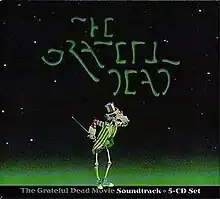 A dancing skeleton wearing an Uncle Sam hat and coat and sneakers and holding a cane