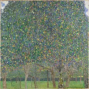 Tree orchard. The leaves of the front tree take up most of the canvas.