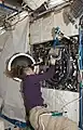 Sandra Magnus as she works with the Combustion Integrated Rack (CIR) in the U.S. Laboratory, Destiny, during maintenance.