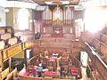 Interior view at Plough Lane Chapel, Lion Street, Brecon looking towards organ.