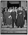 The Italian Ambassador and Senora Fulvia Suvich leaving Holy Rosary Catholic Church after attending a requiem mass in honor of Guglielmo Marconi in 1936.