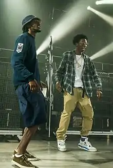 CJ Fly (left) with Joey Badass at the Under the Influence Tour in Toronto, Canada in August 2013