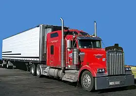 Class 8 Kenworth W900 tractor with spread-axle 48-foot (14.63 m) refrigerated trailer.