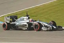 After losing the Vodafone sponsorship in 2013, the McLaren MP4-29 ran with a silver only car, with the car's name on the sidepod, as seen driven by Kevin Magnussen (2014).