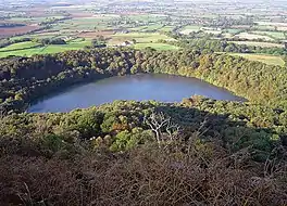 Image looking down of a lake surrounded by trees