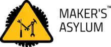 "M" formed using tools inside a Yellow Triangle with circular saw underneath and next to it reads the text "MAKER'S ASYLUM"