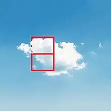 A cloud in the sky with a red glyph drawn on it