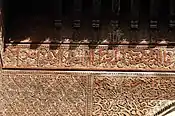 Example of wooden surfaces with ornate carved motifs at the 14th-century Sahrij Madrasa