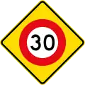 (W10-3) 30&nbsp;km/h speed limit ahead