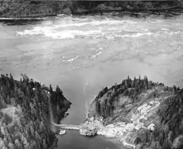 Aerial view of Ripple Rock in 1957. Note the large, turbulent eddies that formed in its wake during low tide.