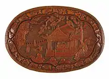 A Chinese carved lacquer oval tray, Yuan dynasty, c. 13th century.